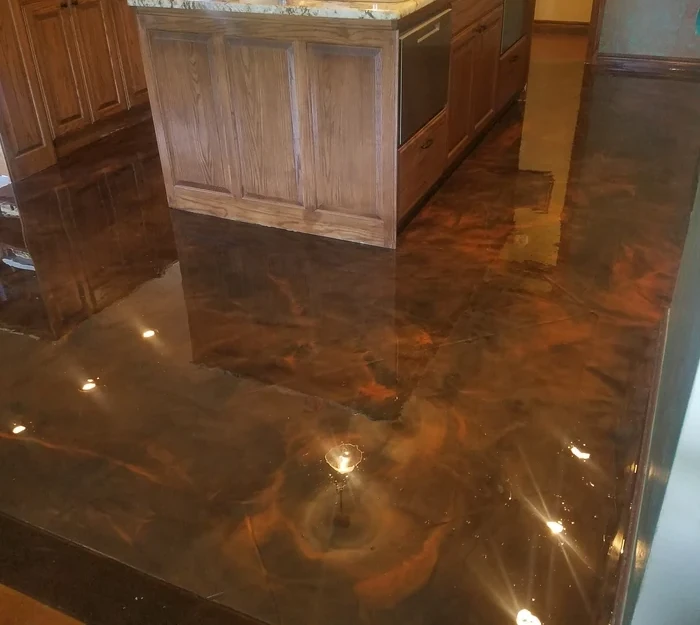 High-gloss metallic epoxy kitchen floor with rich copper and bronze swirls